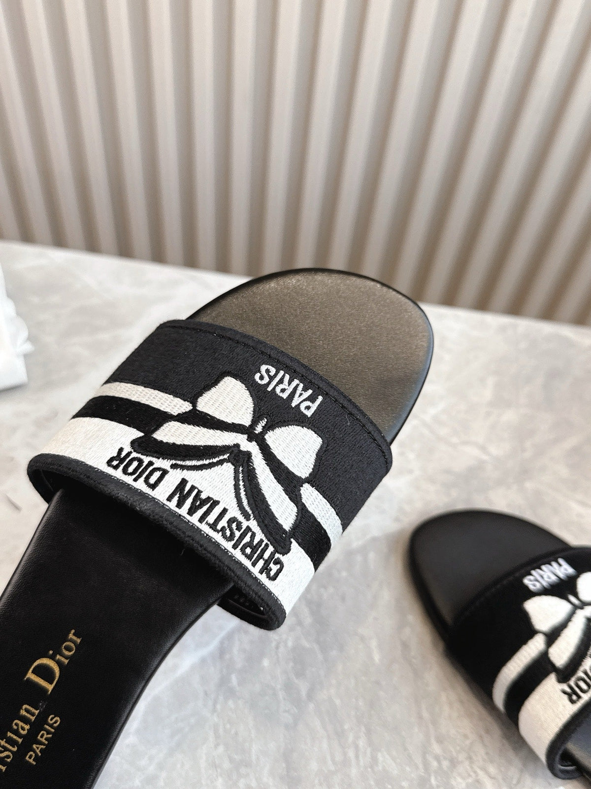 DIOR FLAT SLIDES 25S IN BLACK CALFSKIN AND FABRIC BRAND NAME EMBROIDERY